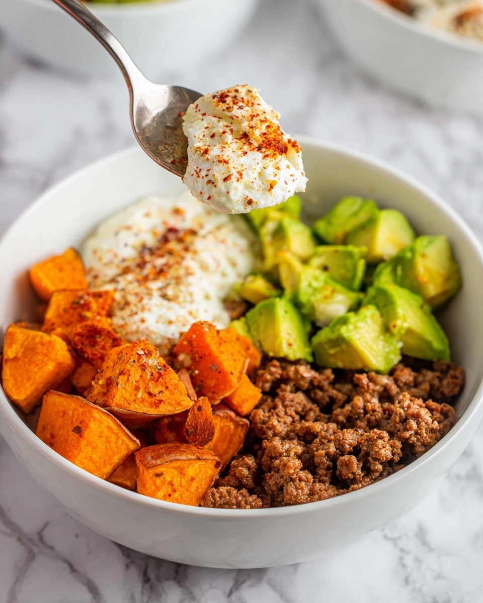The image shows raw ingredients laid out on a white marbled surface. In the center right, there is a white plate filled with a large mound of red ground beef with white fat specks. Above it, a small white bowl holds a fluffy, white cottage cheese. To the top left of the bowl, there is a dark, rough-textured whole avocado. Next to the avocado, two medium-sized, unpeeled sweet potatoes with rough orange skin lie side by side. Below the sweet potatoes are four small clear glass bowls arranged in a square, containing different powdered spices: bright red chili powder, a yellow garlic powder, white shredded coconut, and crushed red pepper flakes. In the bottom left corner, two small white bowls contain white salt and golden honey, respectively. The whole setup is clean and neatly organized. Photo taken with an iphone --ar 4:5 --v 7
