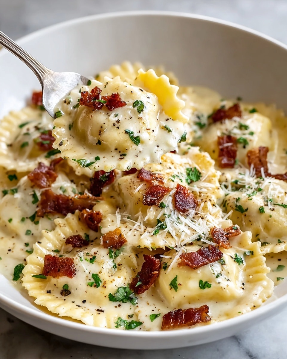A white bowl filled with a creamy sauce covering several pieces of round ravioli with ruffled edges, each ravioli showing a pale yellow color. The creamy sauce has a smooth texture and a light cream color. On top, small pieces of crispy dark brown bacon and finely chopped fresh green herbs are sprinkled evenly. Shredded light-colored cheese and tiny black pepper flakes are scattered across the dish. A silver fork lifts one ravioli from the bowl, showing the sauce, bacon, herbs, cheese, and pepper clearly on top. The bowl sits on a white marbled texture surface. photo taken with an iphone --ar 4:5 --v 7