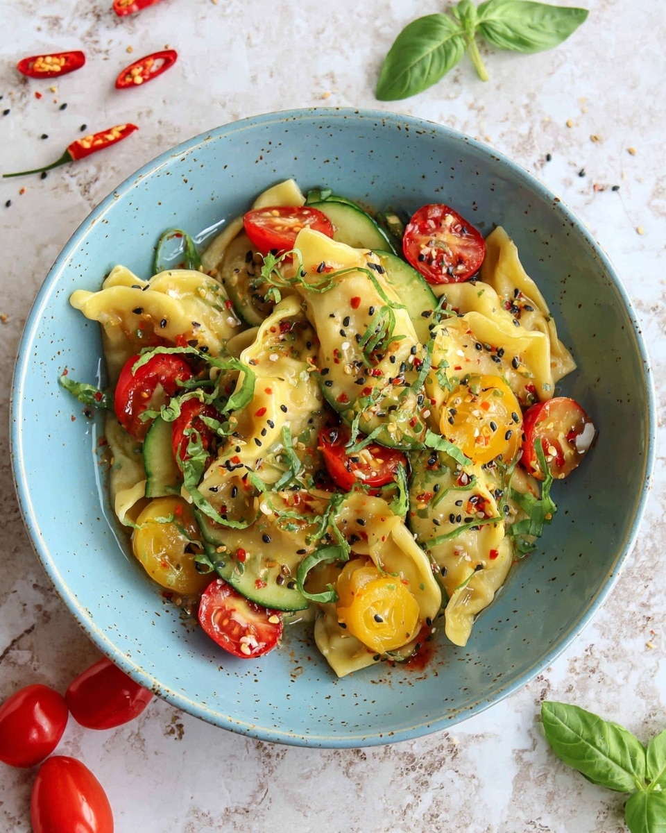 A light blue bowl is filled with several pieces of golden yellow dumplings layered with sliced green cucumbers and halved cherry tomatoes in red and yellow colors. The dish is sprinkled with black sesame seeds and chopped green herbs, giving it a fresh look. The dumplings show some shine from a light sauce, and there are scattered basil leaves around the bowl on a white marbled surface with a few small red chili peppers and black sesame seeds nearby, adding color and texture. photo taken with an iphone --ar 4:5 --v 7