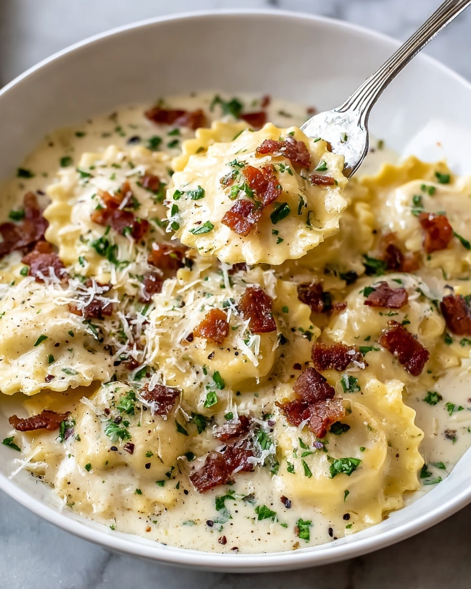 A white bowl filled with round ravioli pasta covered in a creamy white sauce. The ravioli have crimped edges and yellow dough visible through the sauce. On top of the pasta are small bits of dark reddish-brown crispy bacon and green chopped herbs scattered evenly. Shredded white cheese and black pepper specks are sprinkled over everything. A silver fork is lifting one ravioli piece from the dish, showing its rounded, saucy texture. The dish is on a white marbled surface. photo taken with an iphone --ar 4:5 --v 7