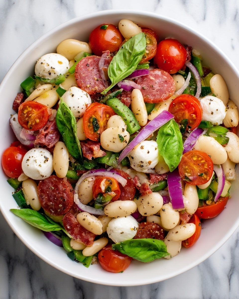 A white bowl filled with a colorful salad on a white marbled surface, layered mainly with large, pale beige butter beans as the base, scattered with halved bright red cherry tomatoes and small white mozzarella balls. Mixed within are pieces of green bell pepper, finely chopped purple onion, and small bits of reddish-brown salami evenly spread across. Fresh green basil leaves are scattered on top, adding a touch of green and texture. The salad is lightly sprinkled with black pepper and herbs, creating a fresh, vibrant appearance. photo taken with an iphone --ar 4:5 --v 7