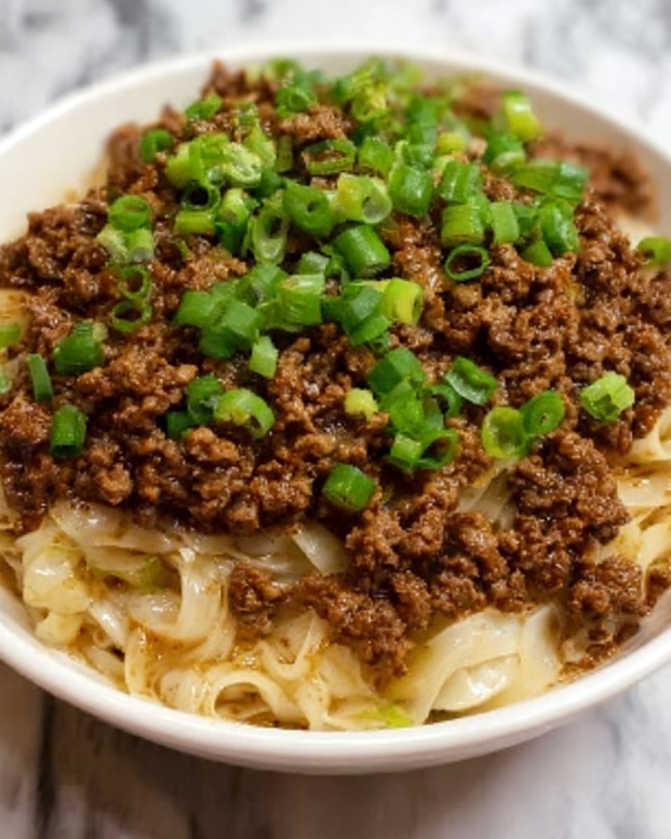 Two stacked square sandwich halves rest on a white plate over a white marbled surface. Each sandwich has three layers: the bottom layer is light toast bread with a soft texture, the middle layer is a mix of creamy orange cheese with chopped white boiled eggs and green jalapeño slices, some pieces of chopped green herbs add contrast, and the top layer is the golden-browned melted cheese with some crispy edges. The top sandwich is slightly tilted, showing the inside fillings clearly. Small green chive pieces are scattered lightly on the plate. Photo taken with an iphone --ar 4:5 --v 7
