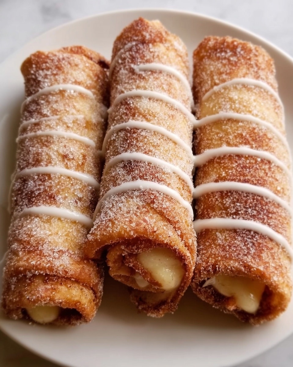 Four golden-brown rolled pastries are stacked on a white plate, each dusted with sugar and cinnamon. A creamy white glaze is drizzled evenly over the top, adding a shiny texture. The pastries have a crispy, slightly rough outer layer, with a smooth creamy filling visible at the ends. The plate rests on a white marbled surface. photo taken with an iphone --ar 4:5 --v 7
